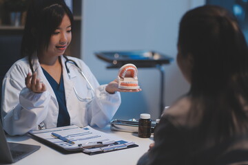 Dentist and patient discussion about planned dental treatment in dental clinic office, doctors talk and work. health care talk medical conference concept