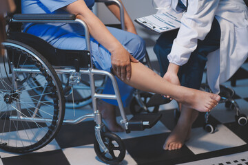 Obraz premium Asian young professional successful friendly female nurse in blue hospital uniform helping supporting physical therapy senior old pensioner unhealthy injury woman patient walking via four legs walker.