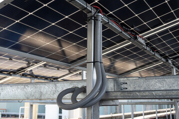Waterproof flexible conduit for wiring and connecting to perforated tray, solar cell system