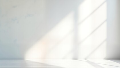 Empty studio interior with white wall, wooden floor. Sunlight casts soft shadows from window. Blank space perfect for product presentation text insertion. Minimalist design. Ideal for modern