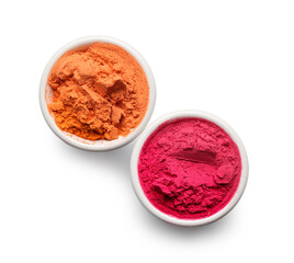 Bowls of color powder pigments on white background