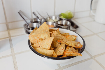 Totopos plate: traditional fried tortilla from Mexico usually eaten as appetizer with chili sauces