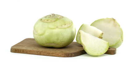 Fresh Kohlrabi Whole and Sliced on a Wooden Cutting Board