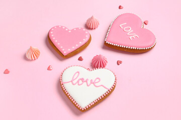 Heart shaped cookies with decor on pink background. Valentine's day celebration