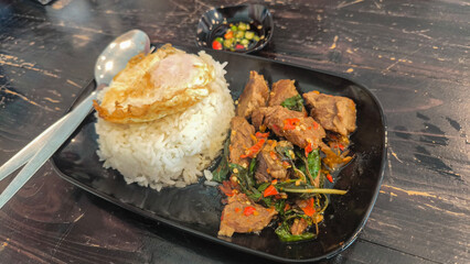 Food concept Thai authentic Khao Pad kra pao rice with Thai Holy Basil beef Stir-Fry
