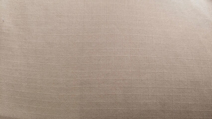 Brown linen fabric cloth texture for background, natural textile pattern.