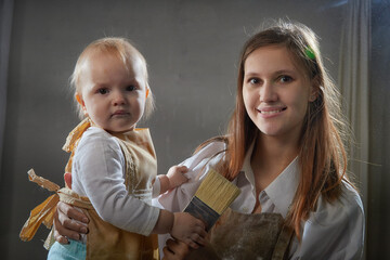 Mother and daughter in aprons joyfully playing with flour during a fun kitchen-themed photo shoot...
