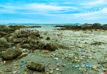 Top view trash, plastic cups and plastic bags at the beach. environmental problem concept and...
