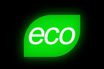 Glowing eco symbol on a black background, representing energy efficiency, sustainability, and eco-friendly design with a modern look.