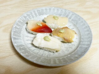 Assorted shellfish sushi on wood table