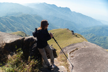 Hiker asian backpack walking trail activity camping outdoors and People exploring forest green natural capturing beauty nature outdoor.