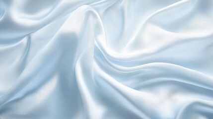Obraz premium Soft, light blue silk fabric with elegant drapes and folds.