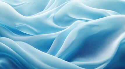 Obraz premium Soft, flowing light blue fabric with elegant drapes and folds.