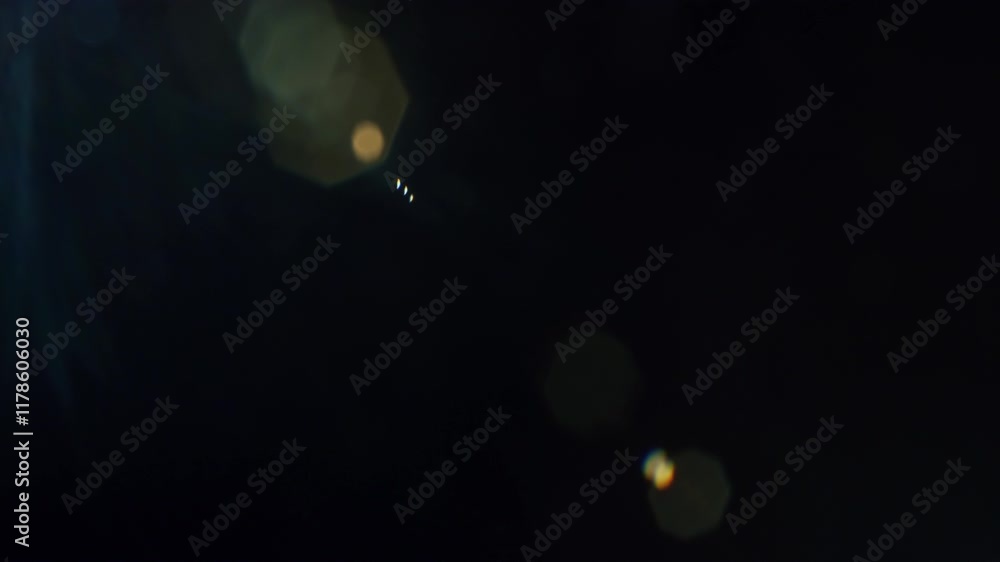 Poster abstract bokeh lights against a dark background in a nighttime setting