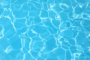 simple background of the water of the pool with light reflections and no people