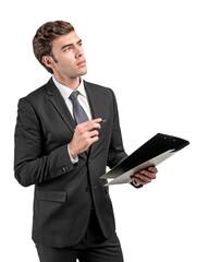 A businessman in a suit holding a clipboard and pen while looking thoughtful, isolated on a clean white background. Concept of planning or decision-making