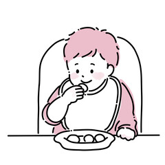 笑顔で手づかみ食べをする赤ちゃん