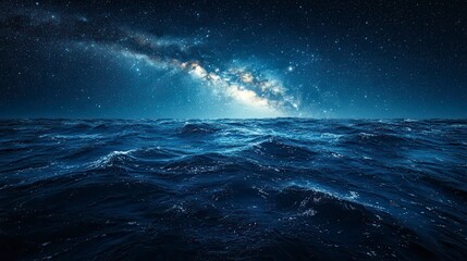 Milky Way galaxy over dark ocean waves at night.