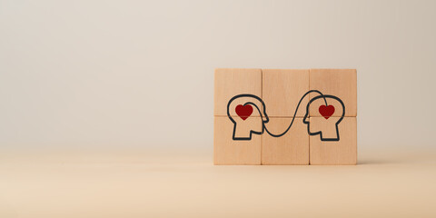Empathy concept. Wooden blocks with empathy icons on minimal background and copy space. The power...