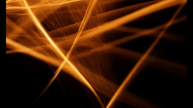 Abstract beautiful bright pattern of fire isolated on black background, blur flame texture in the dark, scattered line of orange color light in the night, material for graphic design 