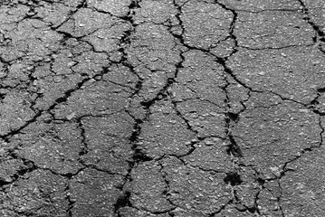 Cracked asphalt texture. Top view. Asphalt. Road background