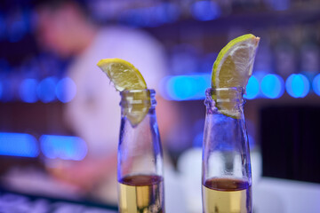 Enjoying Refreshing Beverages with Lime Slices in a Fun and Lively Social Setting