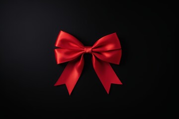 arafed red bow on a black background with a black background
