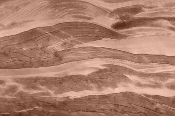 Natural quartzite texture in mocha-mousse tones with elegant layered patterns.