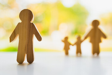 Broken family symbol separating father from mother and children is a concept for today's family...