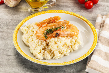 Italian risotto with prawn served thyme