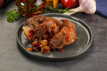 Baked beef ribs with vegetables