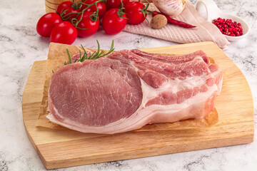 Raw potk loin steak with bone
