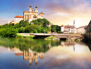 Melk Abbey at dramatic sunrise with reflection in water, Wachau - Lower Austria