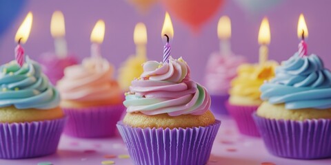 Cupcakes with lit candles