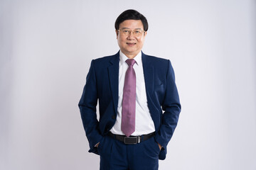 portrait of elderly asian businessman posing on white background