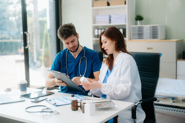 Doctors analyzing results or diagnosis of patient in clinic. Teamwork, medical and healthcare workers