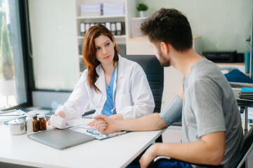 Obraz premium Portrait of female doctor explaining diagnosis to her patient. Doctor Meeting With Patient In Exam Room