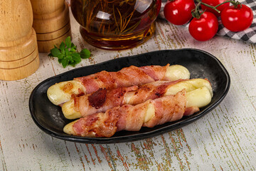 Hot mozzarella sticks with bacon