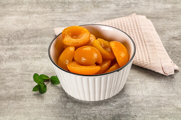 Sweet canned apricots with syrope