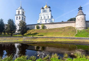 View of the medieval Pskov Kremlin (Krom) and the embankment of the Pskova river in summer day. Pskov, Russia