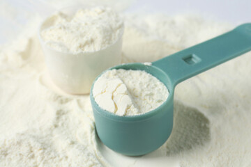 Pile of protein powder and scoops, closeup
