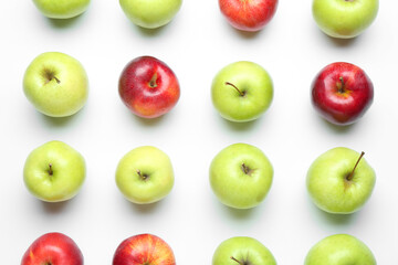 Red and green apples on white background, flat lay