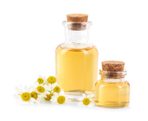 Bottles of essential oil and chamomile flowers isolated on white