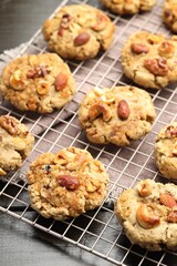 Tasty cookies with nuts on wooden table, closeup