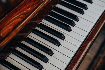Close-up of piano keys capturing the intricate details of a musical instrument in soft natural light