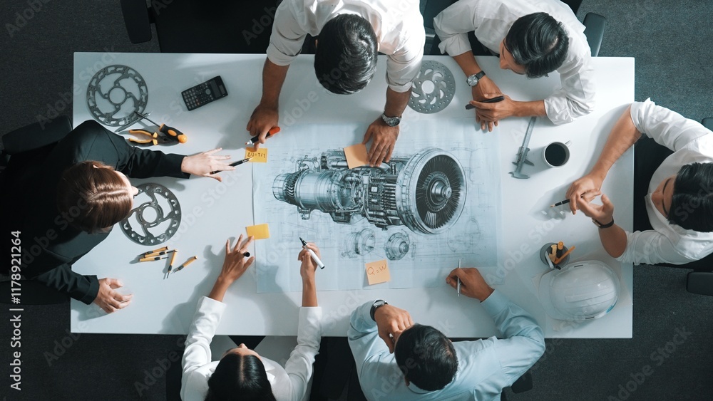 Poster top down aerial view of smart engineer team working together to design turbine engine. professional 