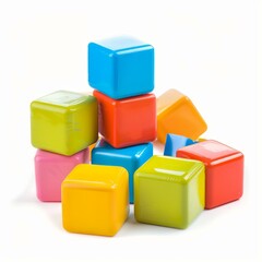 Brightly colored toy cubes stacked and scattered, stimulating creativity and play
