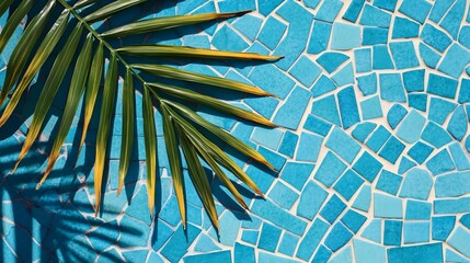 palm leaf shadow on blue mosaic tile - bright