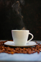 Coffee cup and coffee beans on black background, stock photo