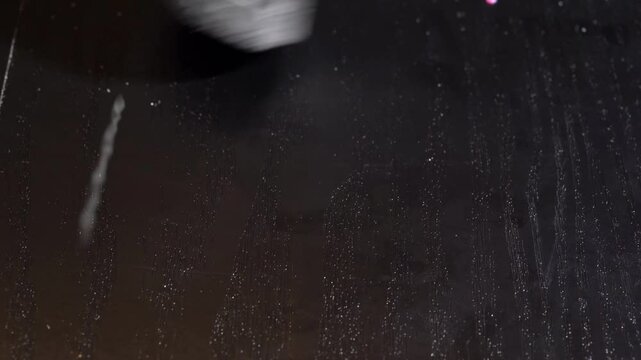 Plastic debris on table is vacuumed away, symbolizing pollution cleanup, waste management, and microplastic removal